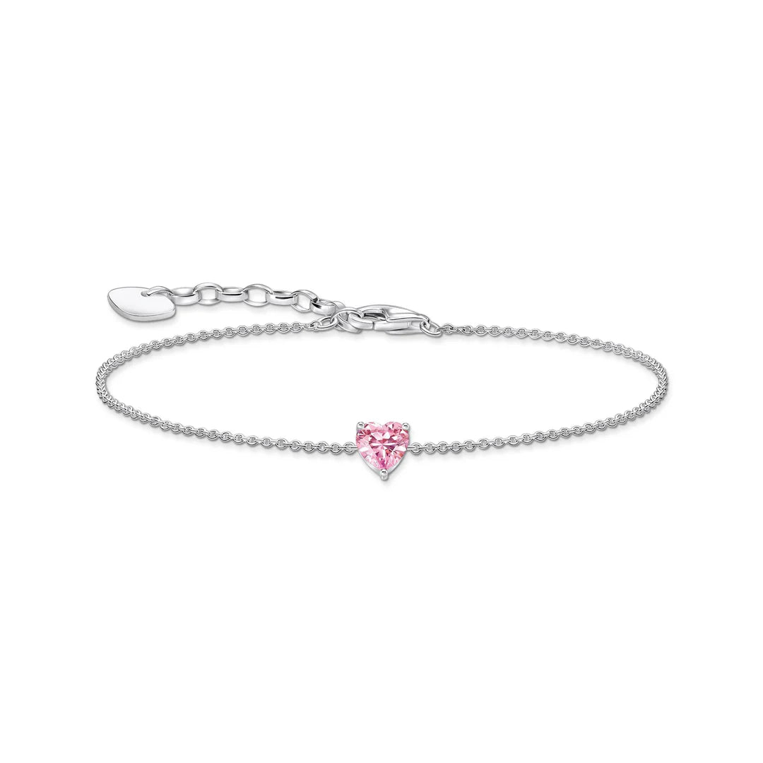 Silver bracelet with a pink heart-shaped charm on a white background